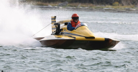 A hydroplane vessel races in Oak Harbor Bay Sept. 10. Whidbey residents flocked to the Oak Harbor shoreline this weekend to watch hydroplanes race around the bay. More than 30 competitive race heats took place Sept. 9 and 10, supplemented by a beer garden, car show and Navy demonstrations. Hydros for Heroes is a nonprofit event, with all proceeds supporting local heroes including military personnel, healthcare professionals, first responders and teachers. (Photo by John Fisken)