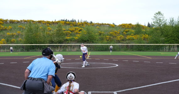 (Photo by Nathan Whalen)
Oak Harbor’s Reece Wasinger throws a pitch during a District 1, 3A softball tournament game against Everett May 9 at Phil Johnson Fields in Everett. The Wildcats lost 11-1 in a loser-out game. Oak Harbor finished its season with a conference record of 11-4 and an overall record of 13-8.